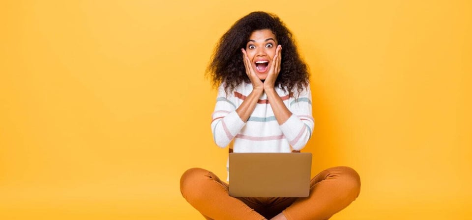 woman-with-laptop-yellow-bg